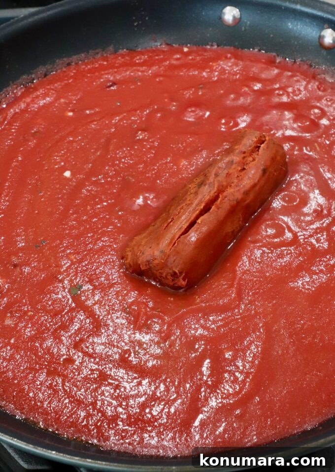 nduja sausage in tomato sauce in a skillet