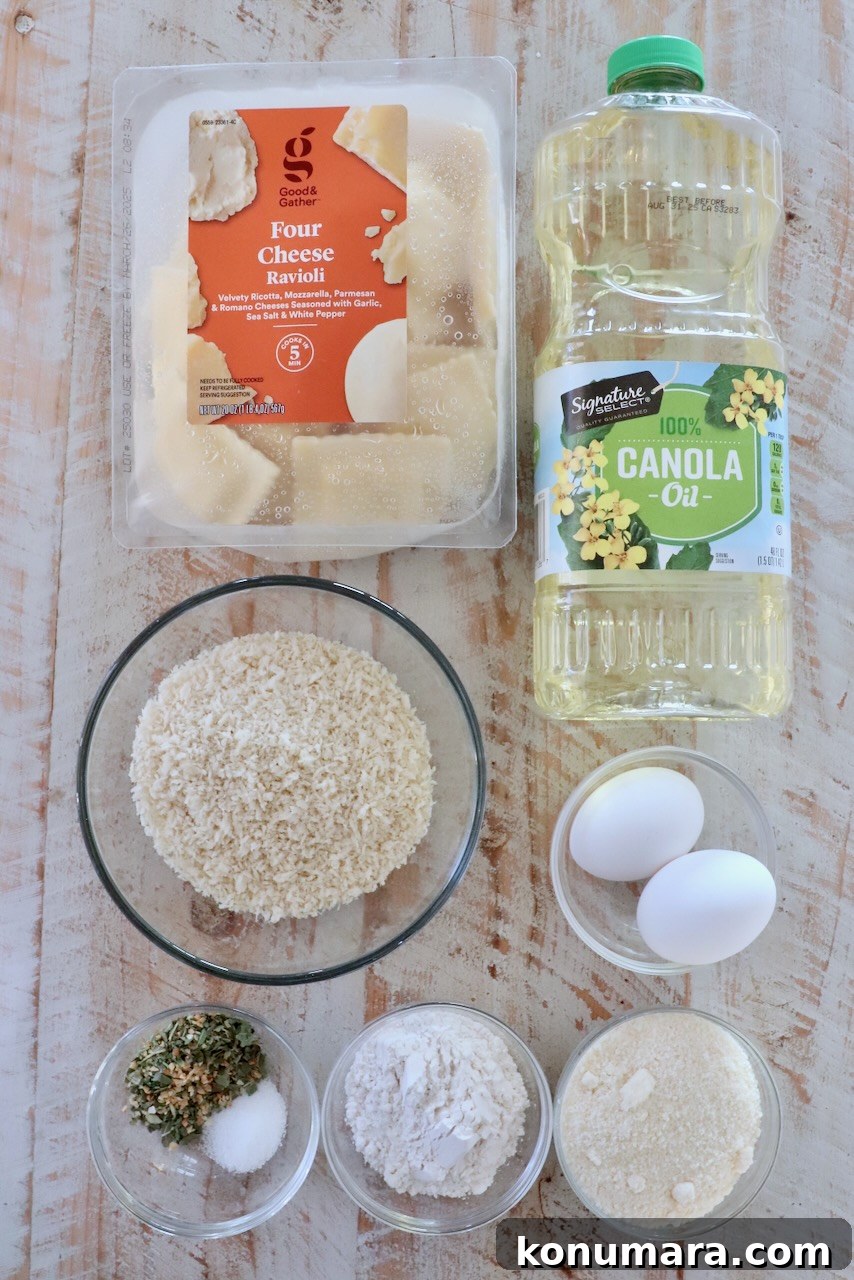 ingredients for toasted raviolis on a white wood board
