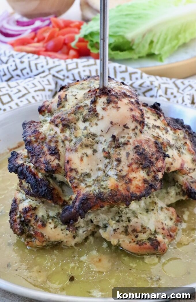 Homemade Greek Chicken Gyros Recipe 6 cooked chicken thighs on a vertical rotisserie