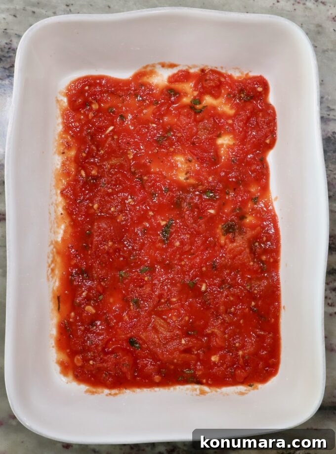 Ricotta Stuffed Shells Recipe with Spinach 6 marinara sauce in the bottom of a casserole dish
