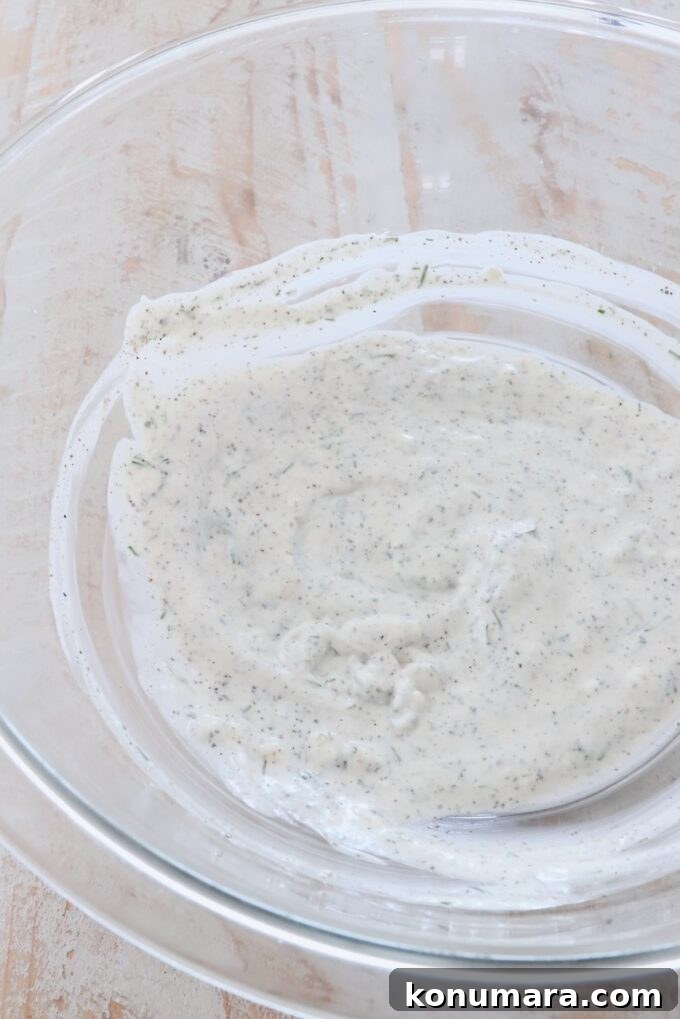 Creamy Cucumber Salad with Dill and Yogurt Dressing 4 creamy dressing in a glass bowl