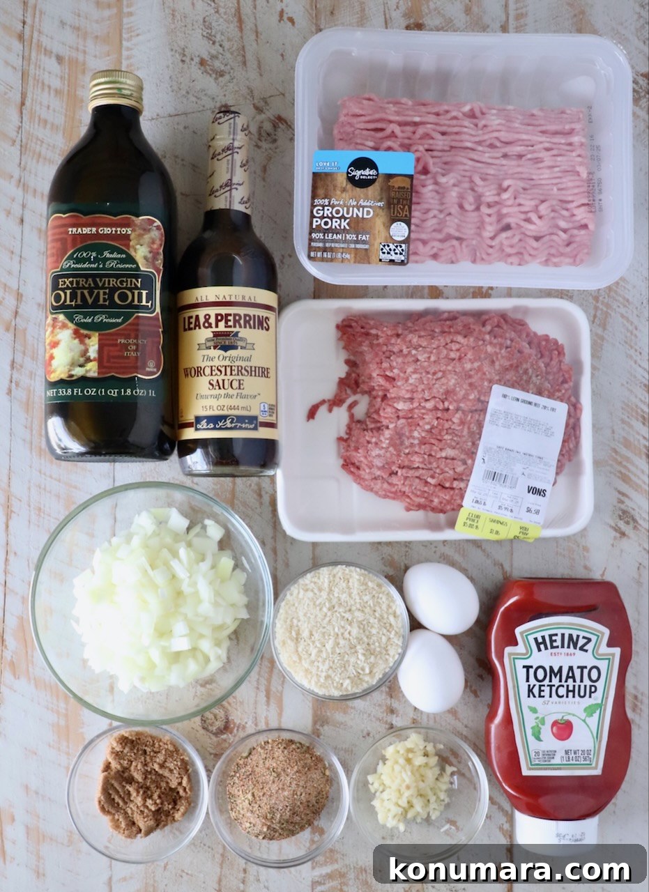 30-Minute Air Fryer Meatloaf Recipe with Crispy Edges 3 ingredients for air fryer meatloaf on a white wood board
