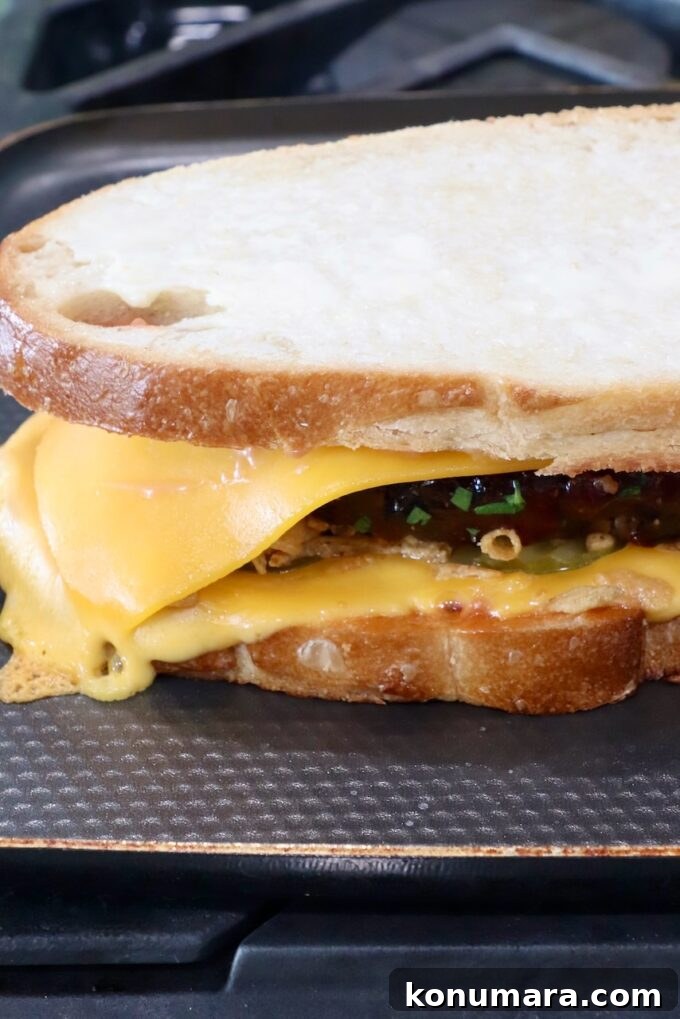 How to Make a Classic Meatloaf Sandwich 8 meatloaf sandwich on a griddle pan on the stove