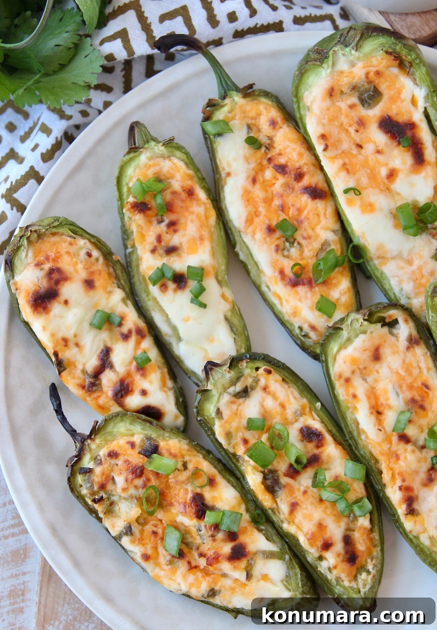 Smoky Grilled Jalapeno Poppers Recipe with Cream Cheese 9 cooked jalapeno poppers on plate