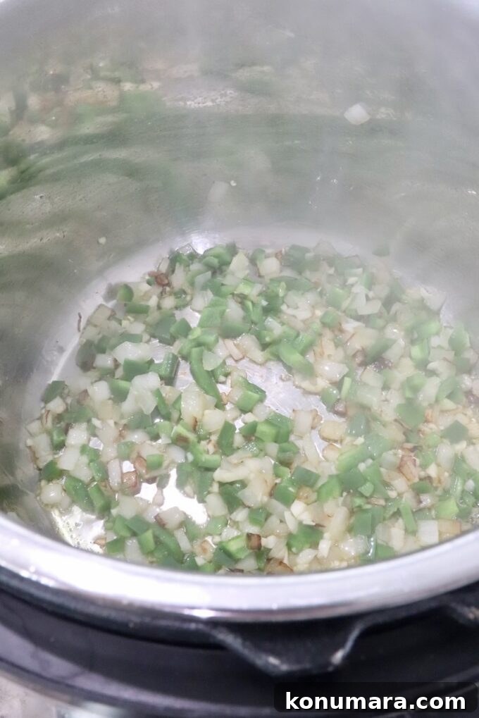 diced onions, jalapenos and garlic in an Instant Pot