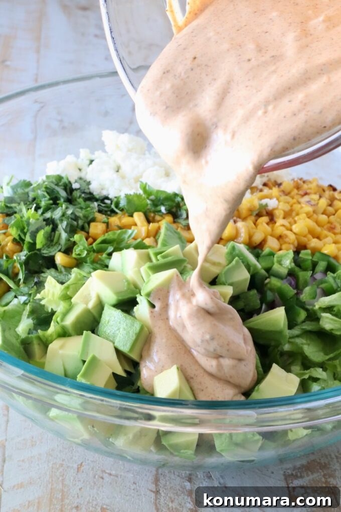 creamy dressing poured over the salad