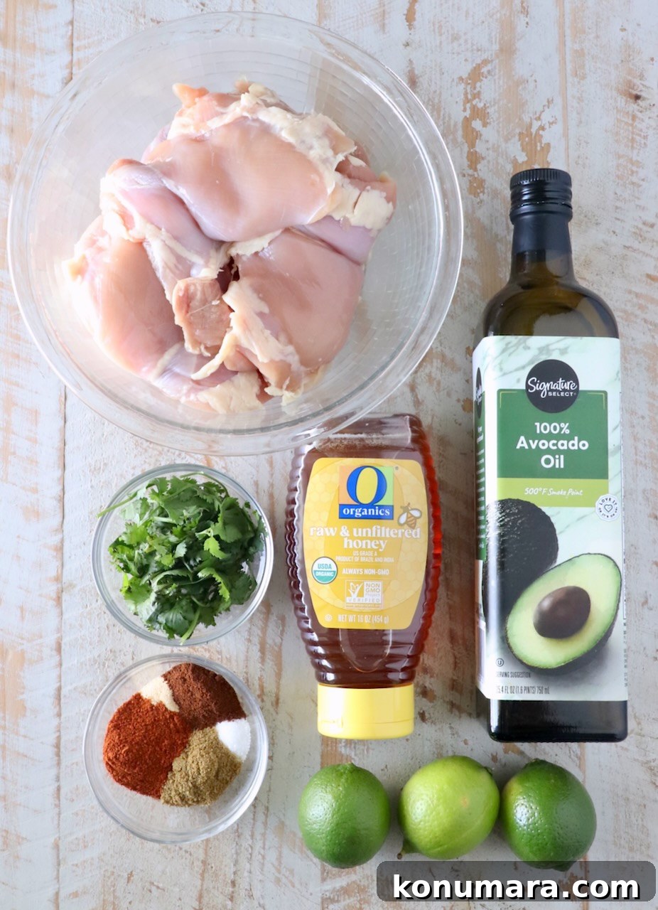Chipotle Honey Glazed Chicken Recipe 5 Ingredients for chipotle honey chicken arranged on a wooden board