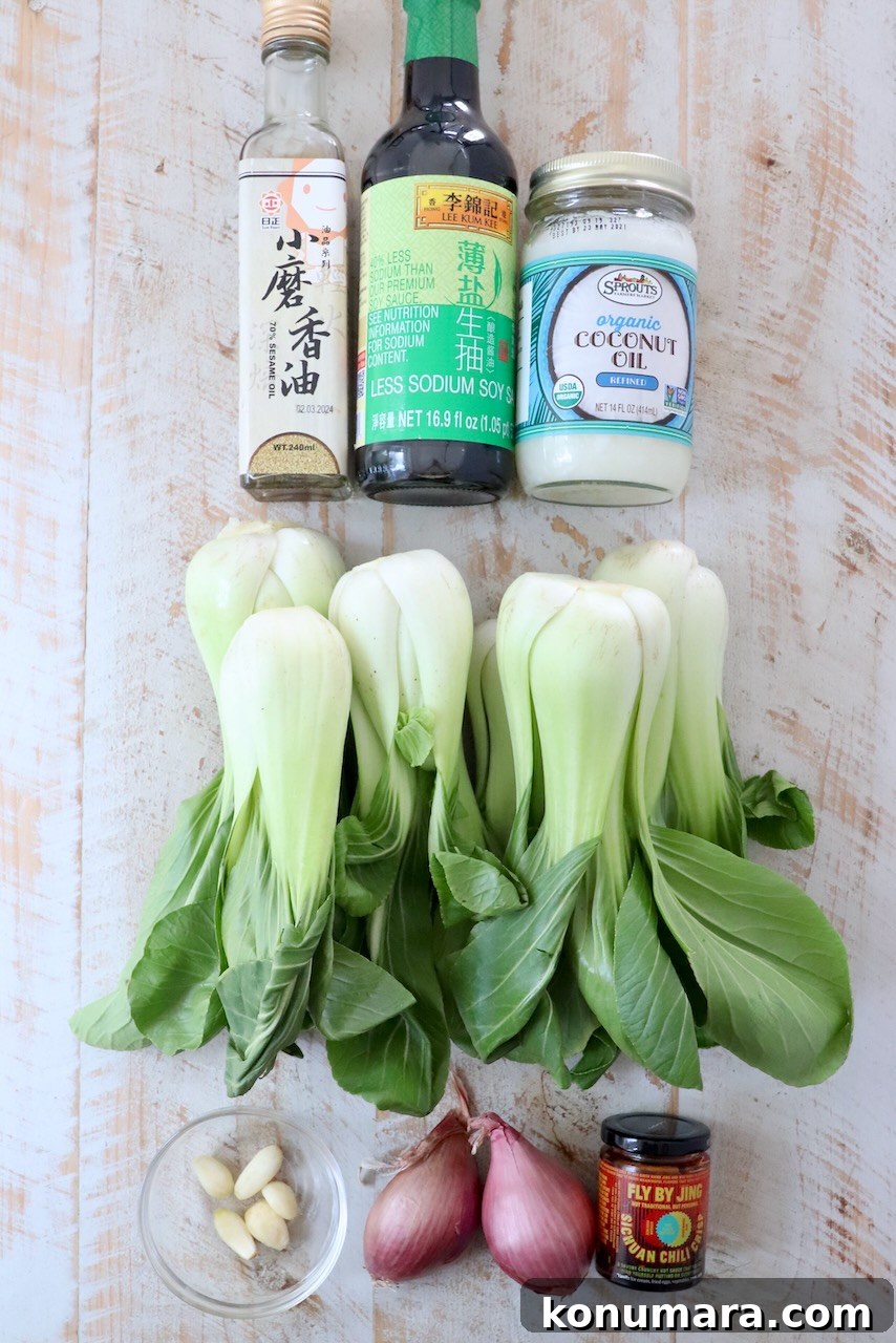 How to Cook Baby Bok Choy: Quick Stir-Fry Recipe and Tips 3 ingredients for baby bok choy on a white wood board