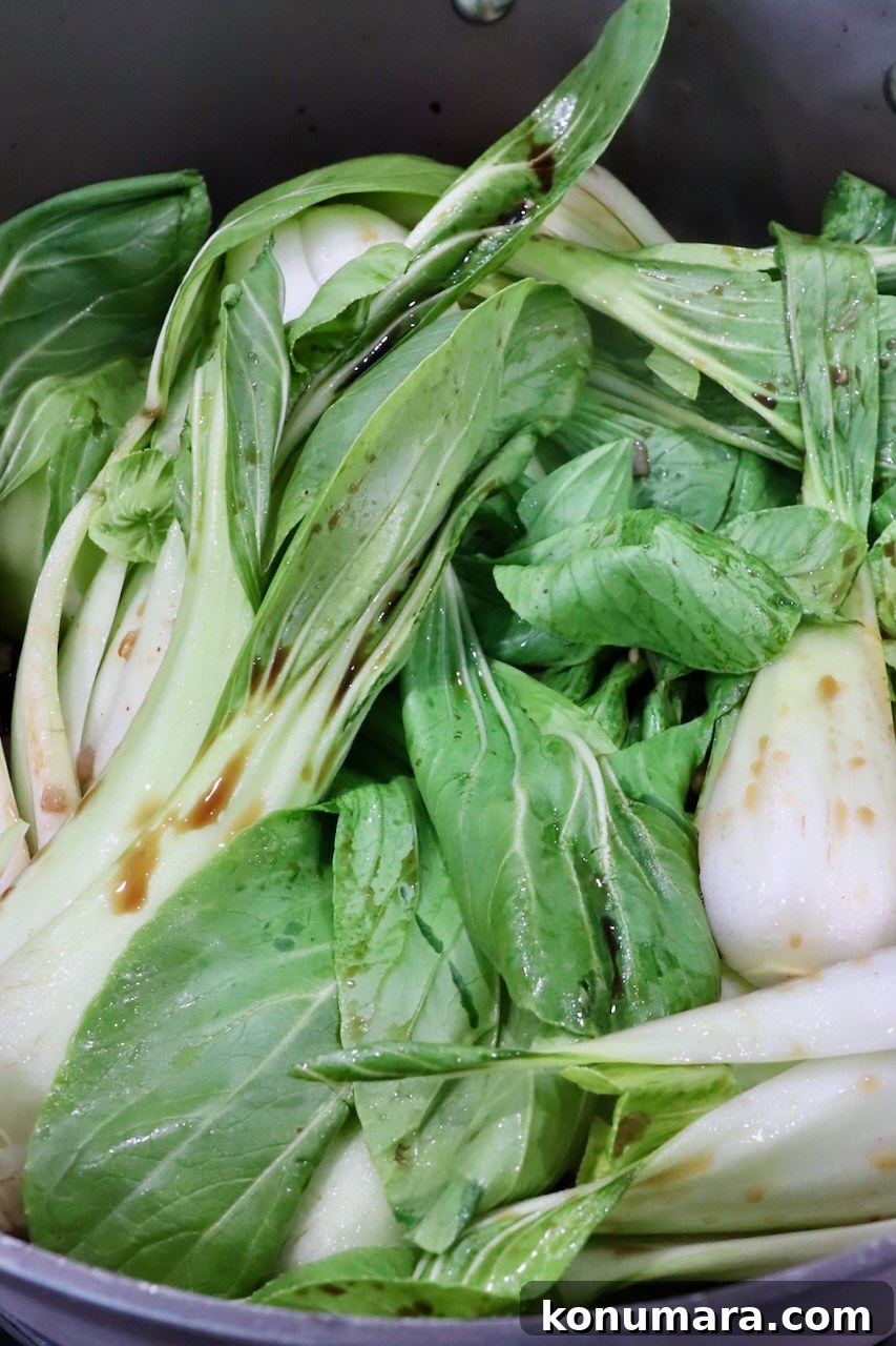 How to Cook Baby Bok Choy: Quick Stir-Fry Recipe and Tips 4 baby bok choy cooking in a large pot