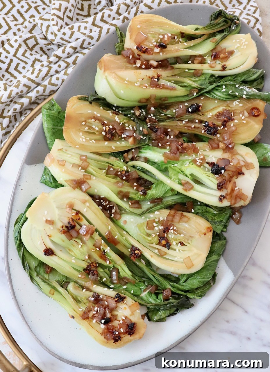 How to Cook Baby Bok Choy: Quick Stir-Fry Recipe and Tips 6 cooked baby bok choy on a serving platter
