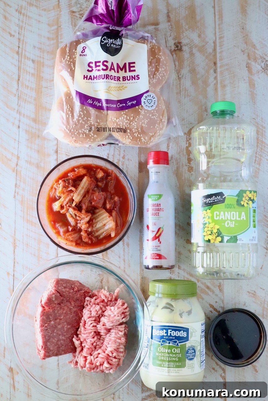 Korean BBQ Burger with Gochujang Glaze and Kimchi Slaw 3 ingredients for korean bbq burgers on a white wood board