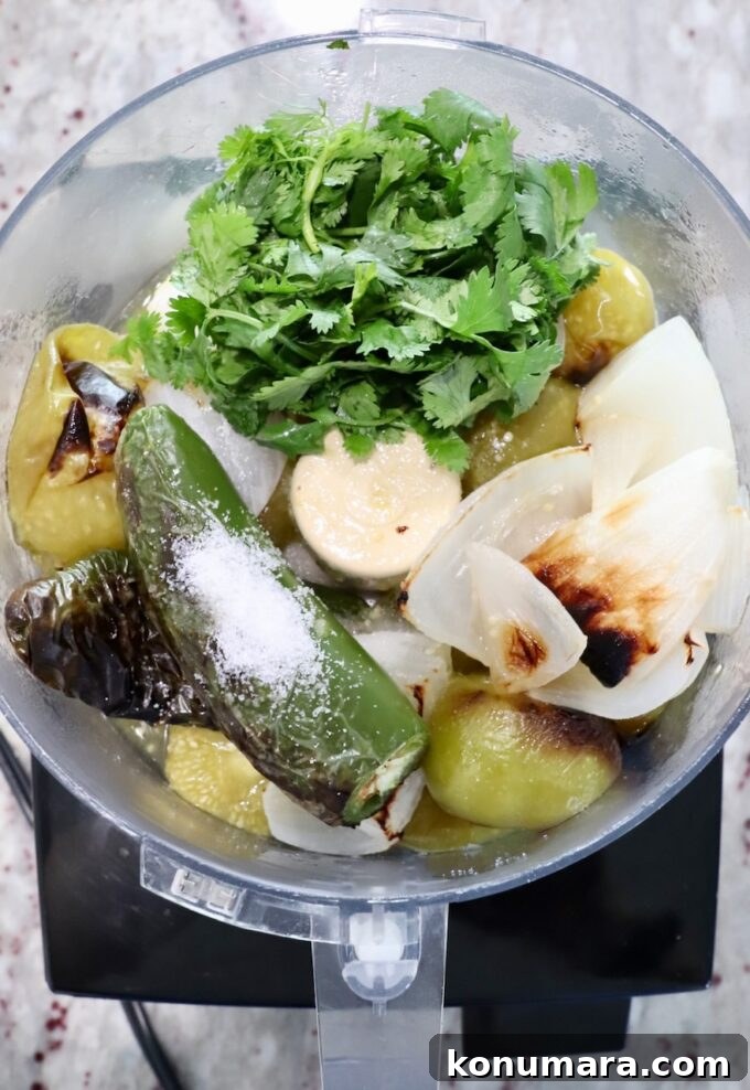 roasted tomatillos, onion and jalapenos in a food processor with salt and cilantro