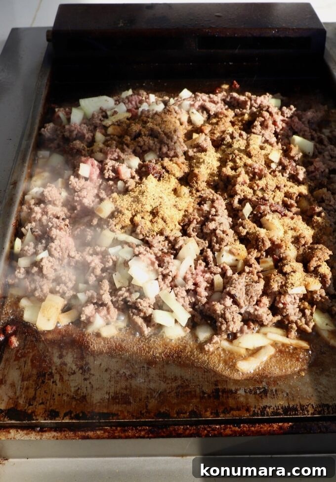 New York Bodega Chopped Cheese Sandwich Recipe 7 seasoned ground beef on a flat top griddle