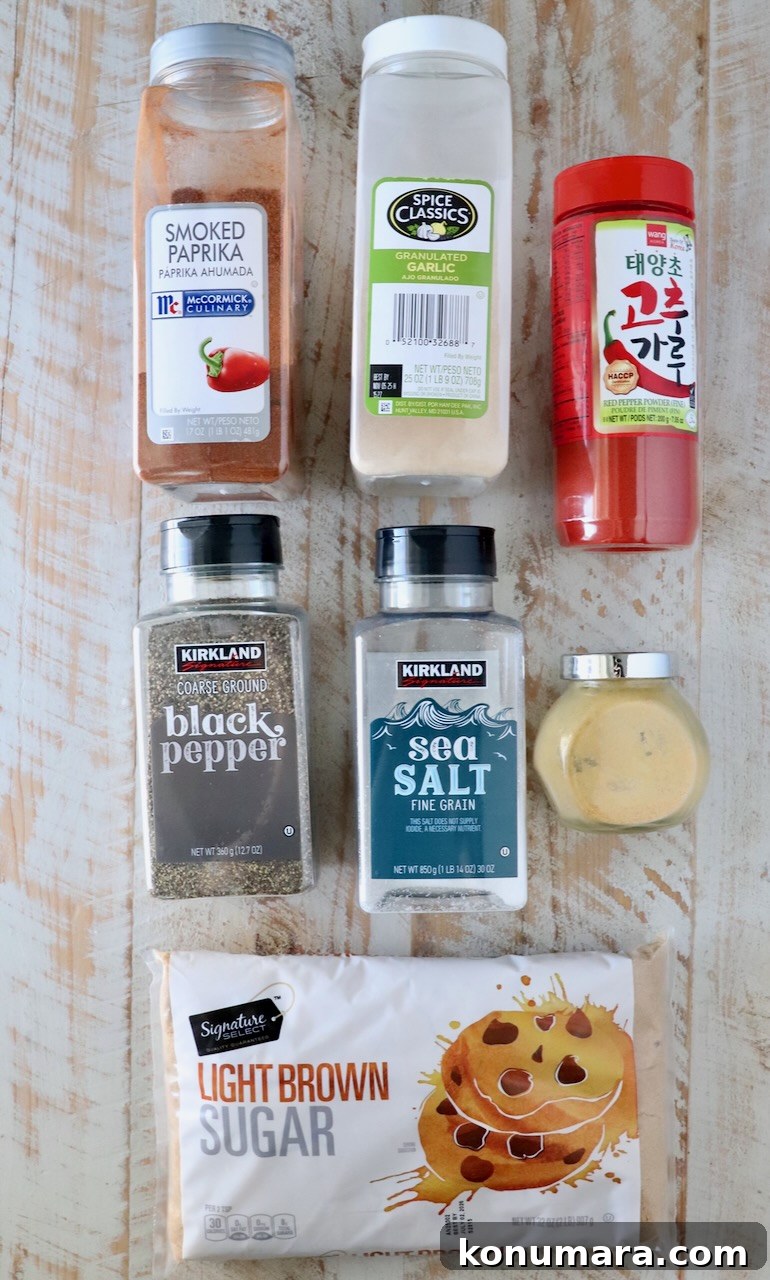 ingredients for Korean bbq seasoning in their containers sitting on a white wood board