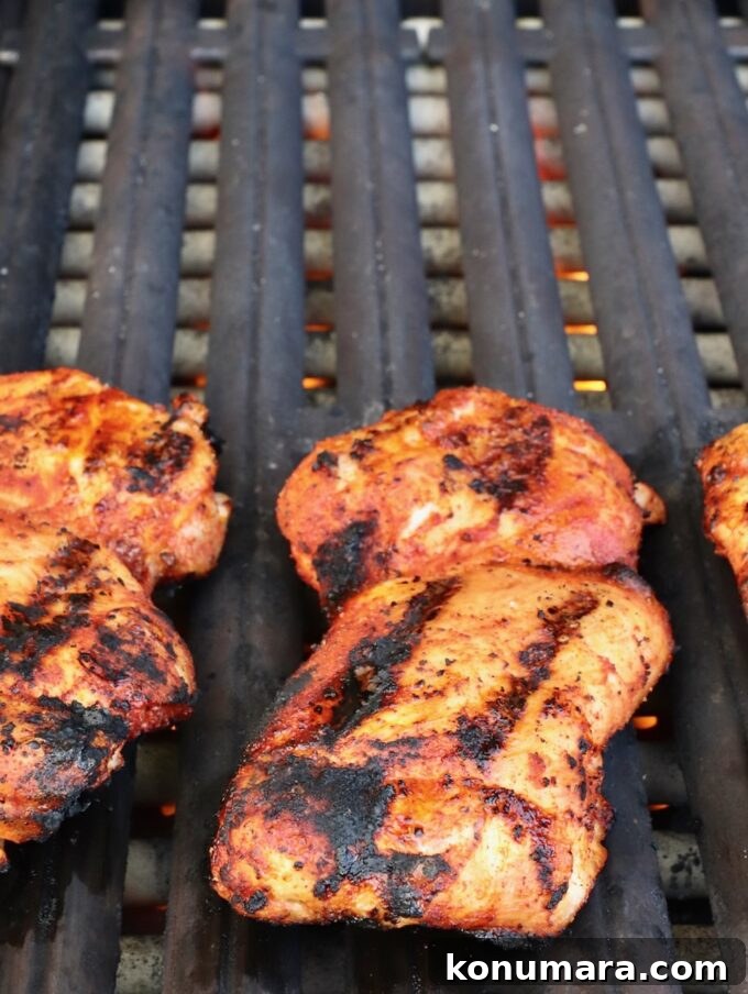 Korean BBQ Chicken with Gochujang Glaze 6 grilled chicken thighs on a grill