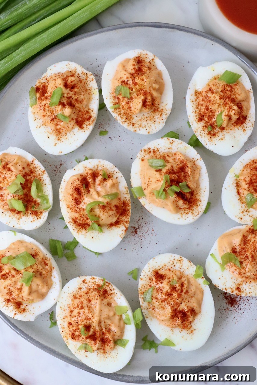 Spicy Buffalo Deviled Eggs Recipe for Game Day 7 Prepared buffalo deviled eggs arranged on a serving plate