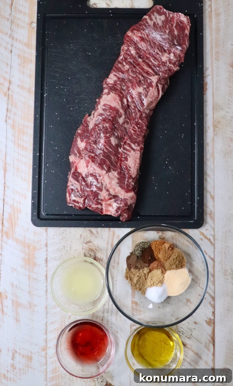 ingredients for beef shawarma on a white wood board