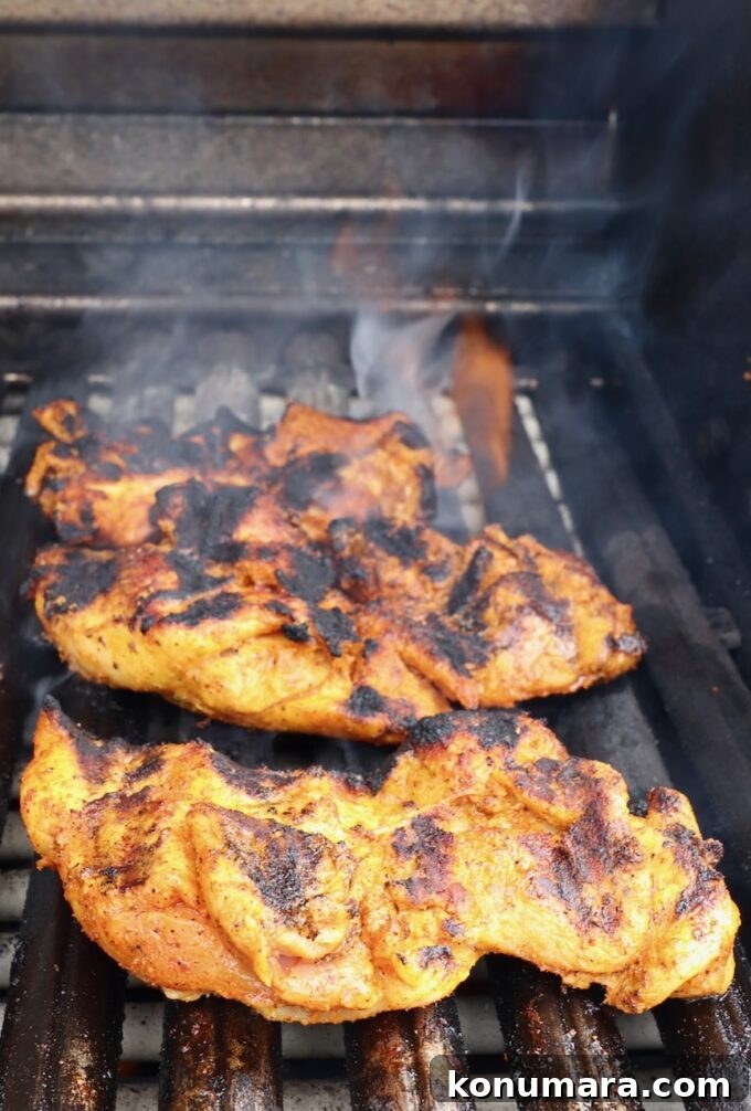 Juicy Grilled Sazon Chicken Thighs Recipe 6 grilled, marinated chicken thighs on a grill