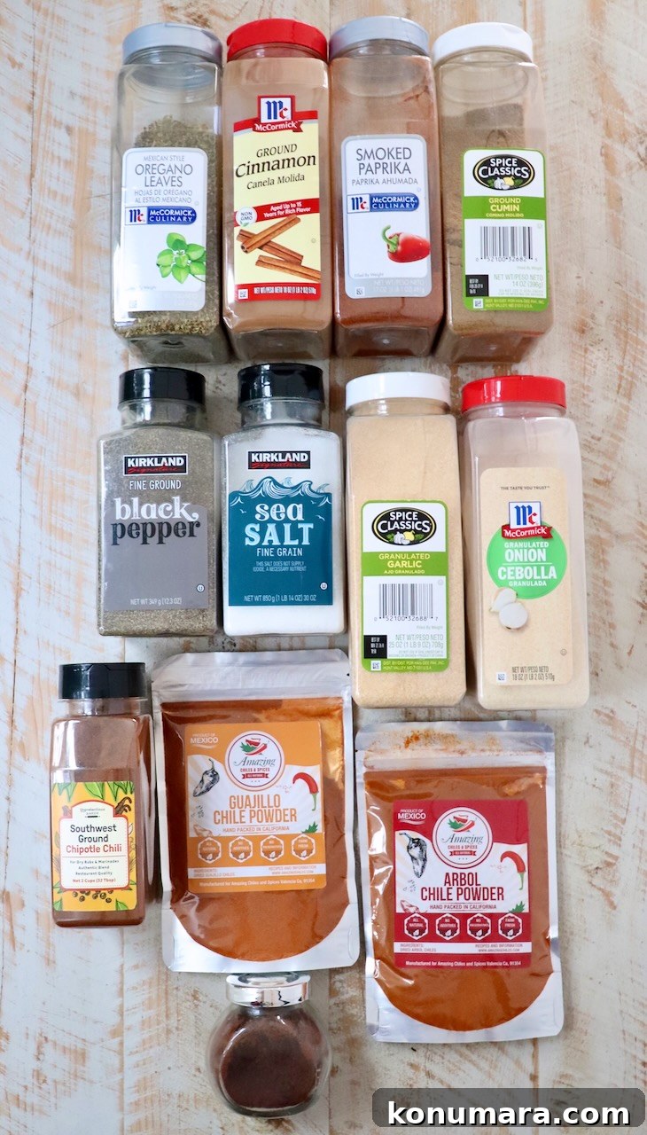 ingredients for birria seasoning on a white wood board