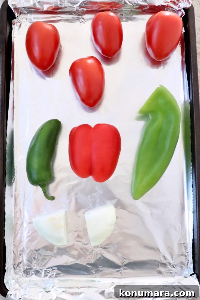 Fresh Peach Salsa with Jalapeño and Cilantro 4 roma tomatoes, peppers and onions on a foil lined baking sheet