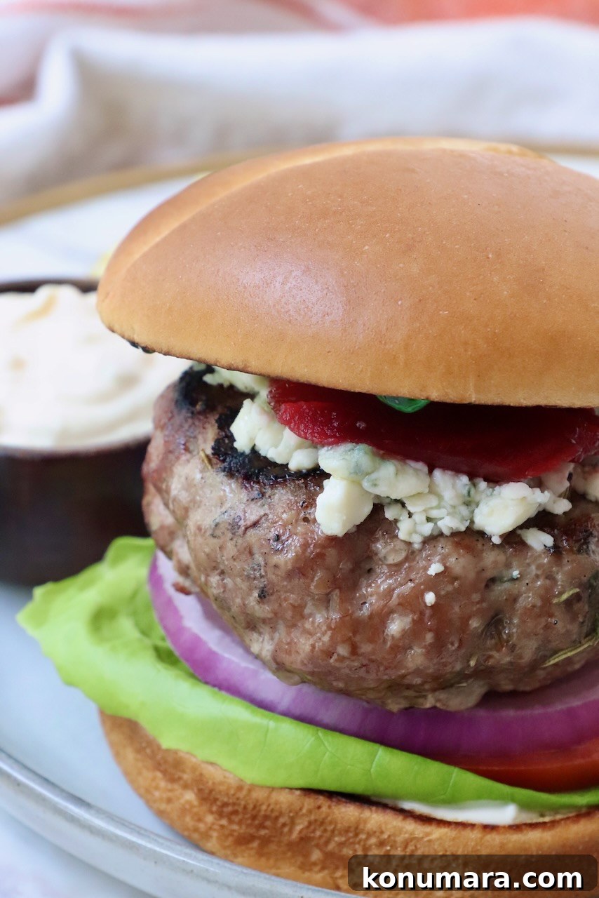 Grilled Mediterranean Lamb Burger with Mint Yogurt Sauce 9 lamb burger on a plate