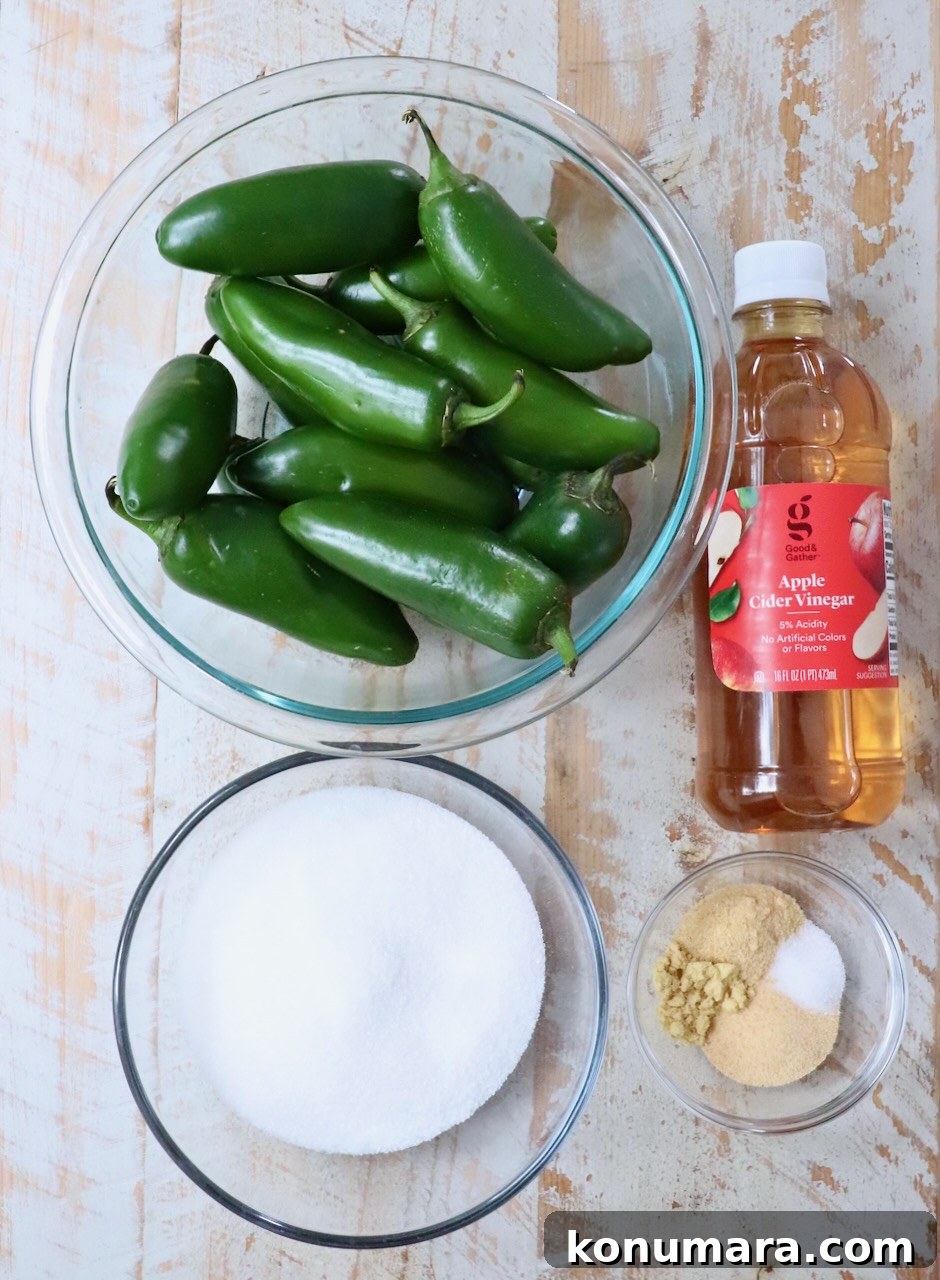 How to Make Sweet and Spicy Candied Jalapenos 3 ingredients for candied jalapenos on a white wood board