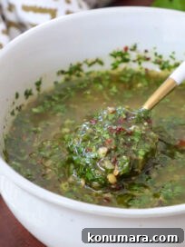 cilantro chimichurri sauce in a bowl with a spoon