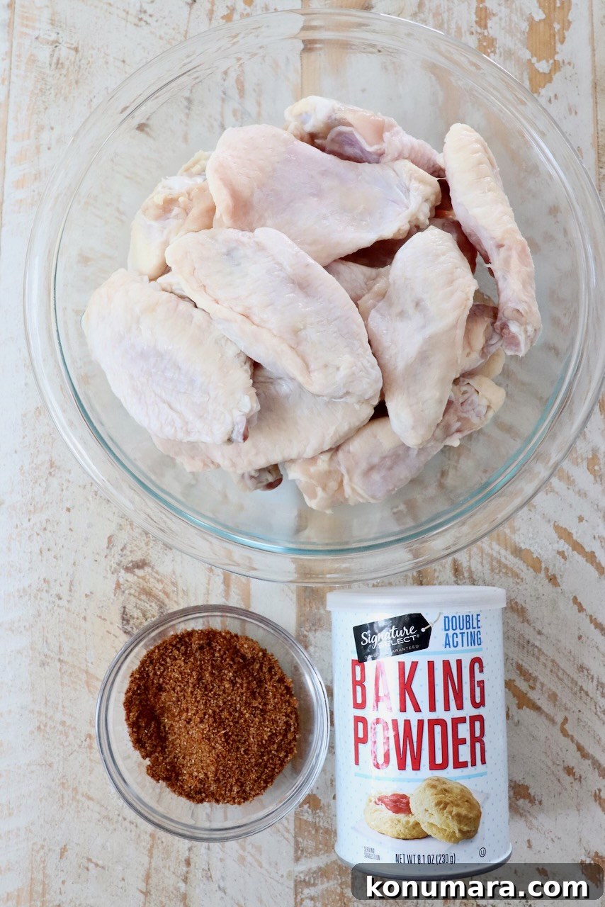 ingredients for cajun wings on a white wood board