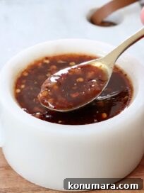 general tso sauce in a small bowl with a spoon