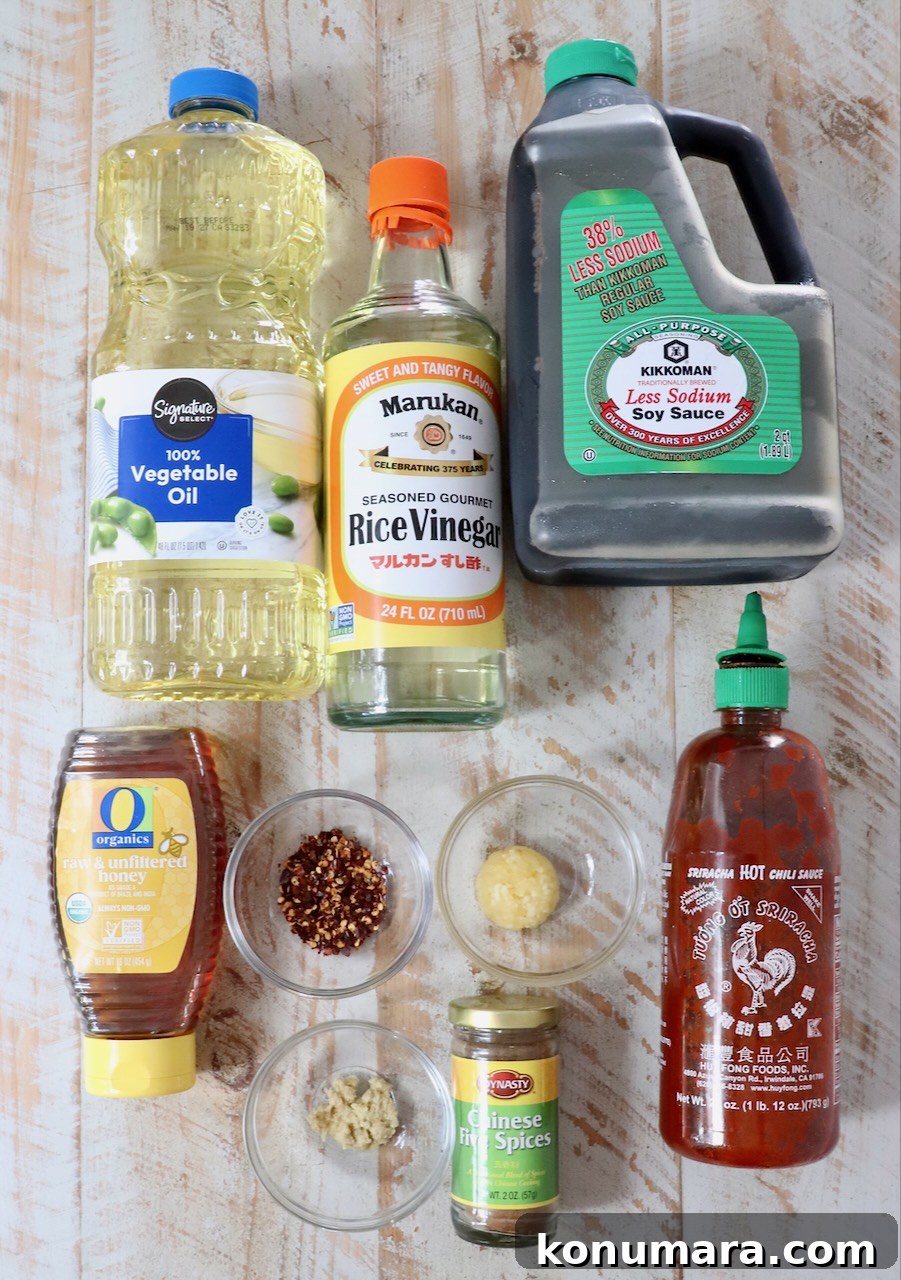 ingredients for general tso sauce on a white wood board
