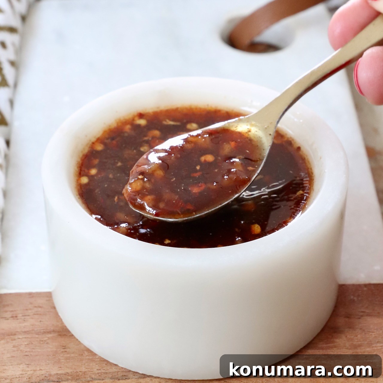 general tso sauce in a small bowl with a spoon