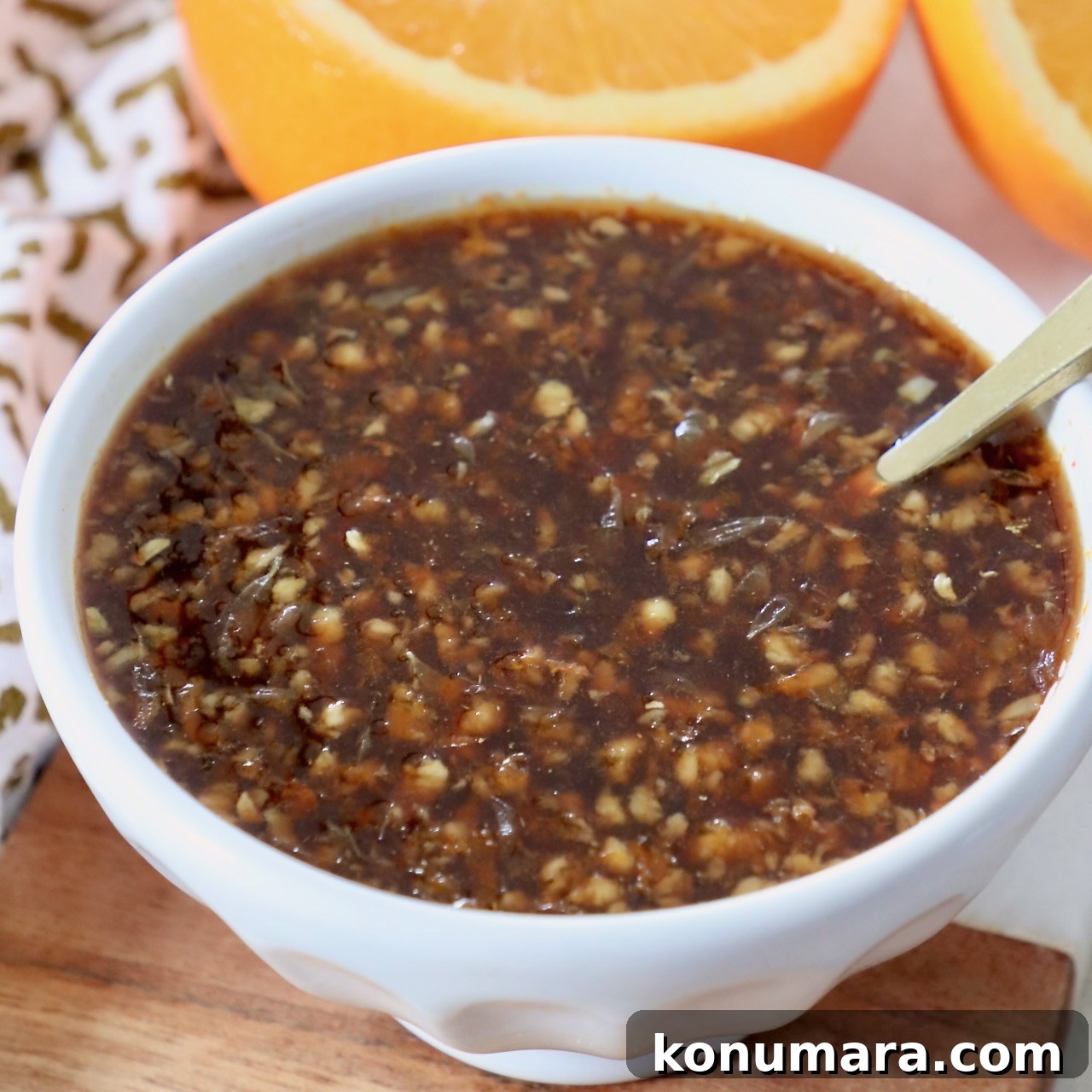 orange sauce in small bowl with spoon