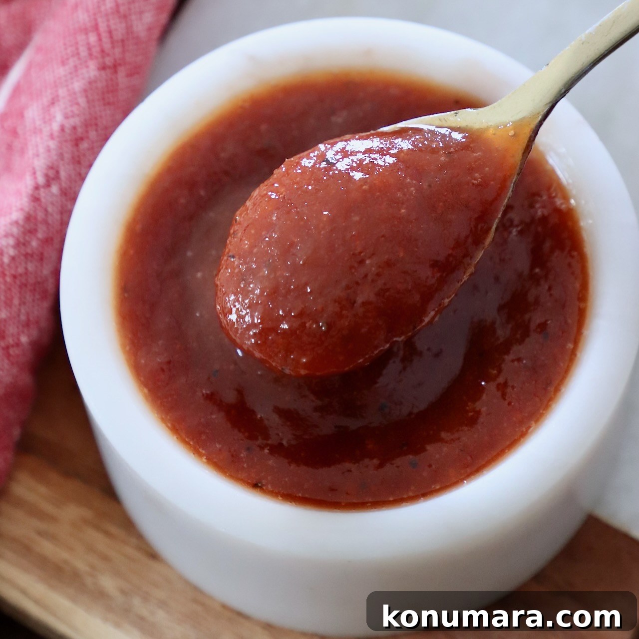bbq sauce in bowl with small spoon