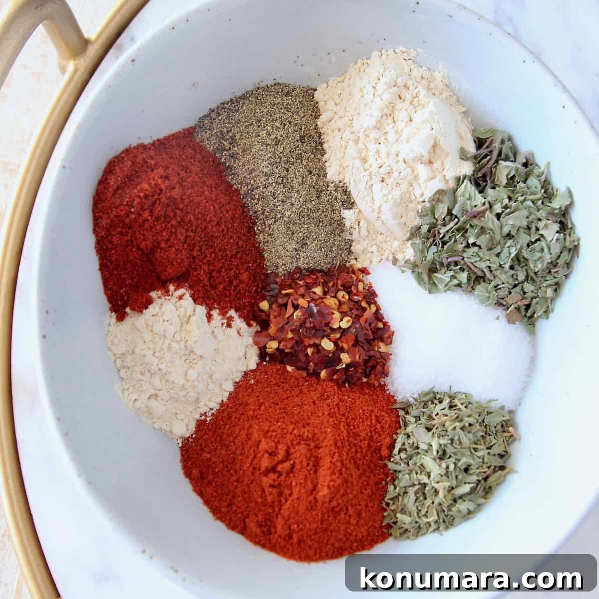 spices and herbs in white bowl