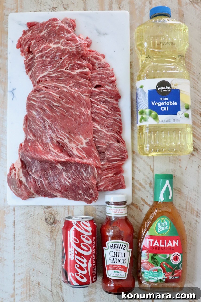 Grilled Steak Tips: Marinade, Sear, and Serve 3 ingredients for steak tips on a white wood board