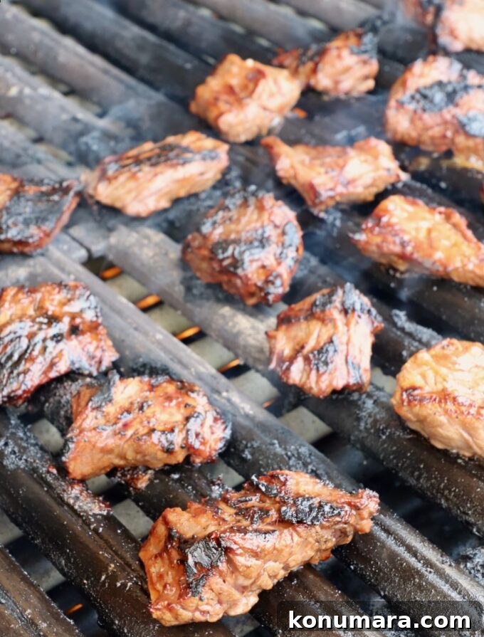 Grilled Steak Tips: Marinade, Sear, and Serve 6 grilled steak tips on a grill