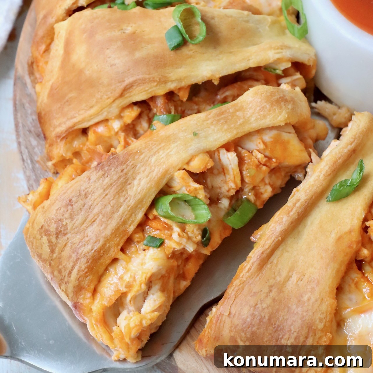 slice of buffalo chicken ring on a spatula