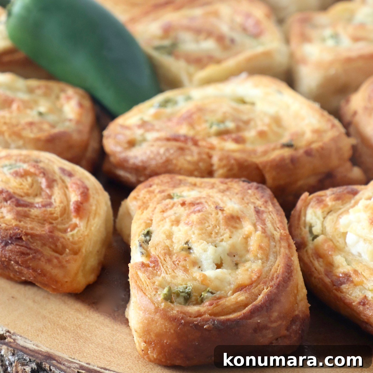 jalapeno popper crescent rolls on wood serving tray