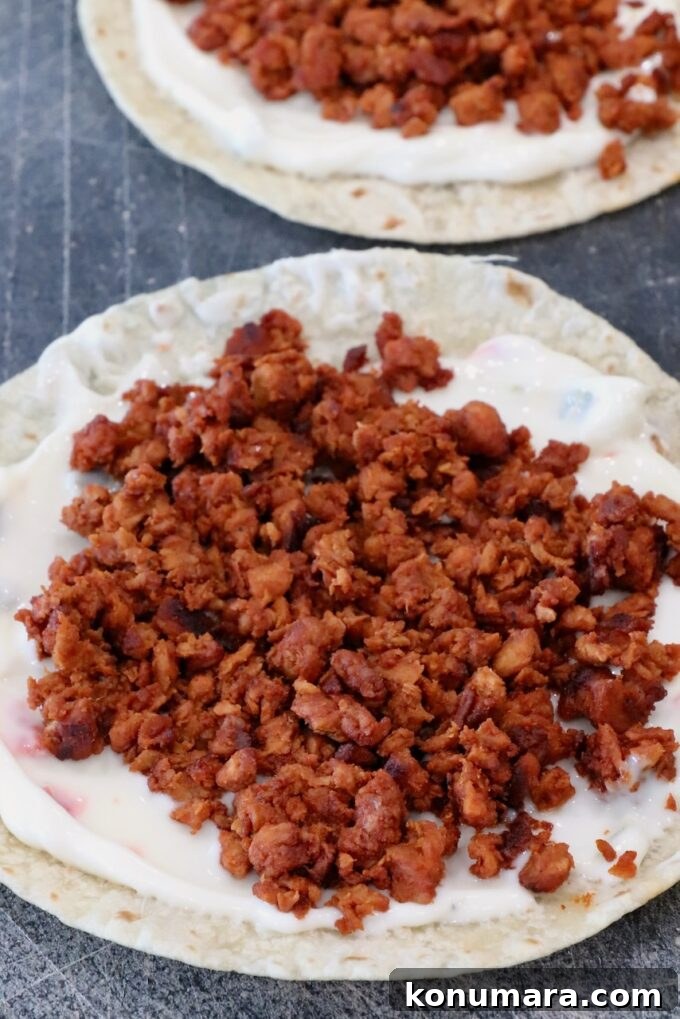 Crispy Chorizo Tacos with Melted Queso 6 cooked, crumbled chorizo on top of queso on a tortilla