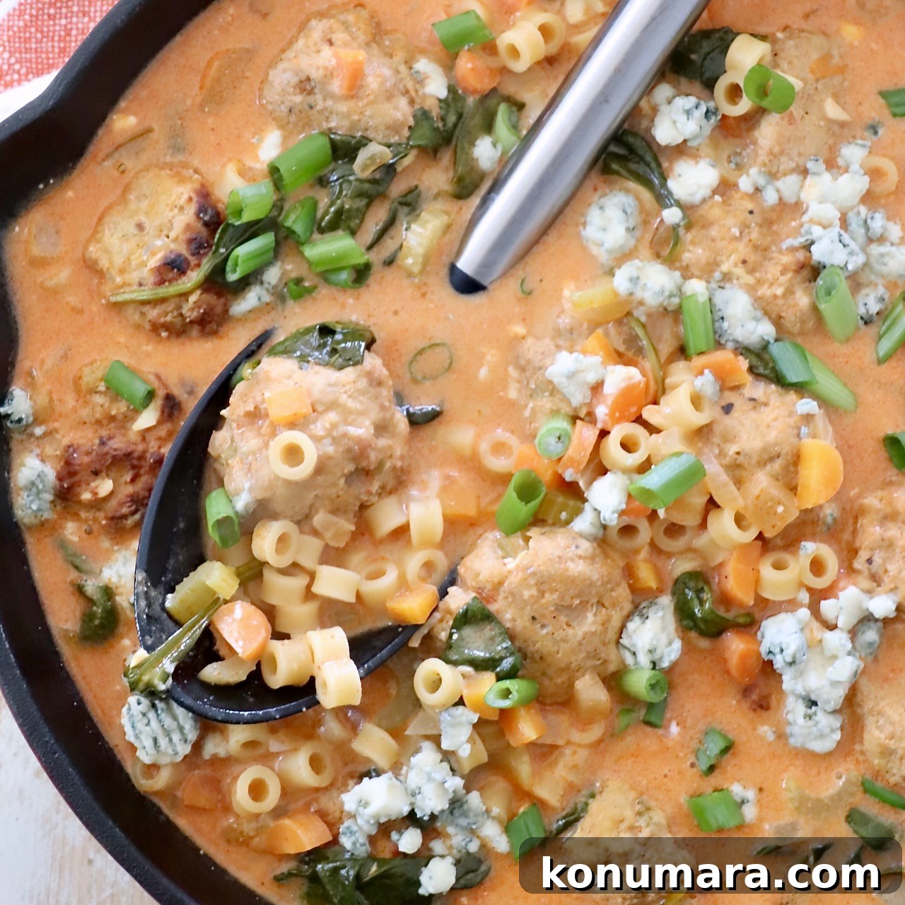 37 Cozy Fall Soup Recipes to Warm the Soul 12 buffalo chicken meatball soup in skillet with spoon