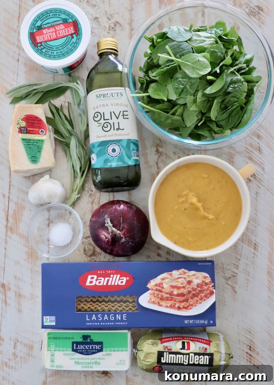 Sheet-Pan Butternut Squash Lasagna Recipe 3 Ingredients for a lasagna dish arranged on a wooden surface. Items include ricotta cheese, olive oil, fresh spinach, mozzarella, lasagna noodles, and sausage.