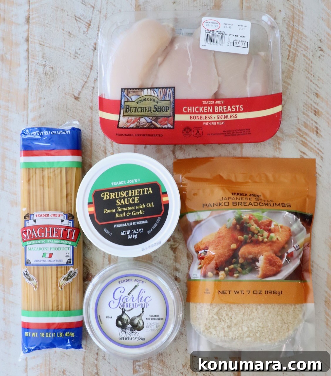 Crispy Garlic Chicken Topped with Tomato Basil Bruschetta 3 A selection of Trader Joe's products on a light wooden surface, including chicken breasts, bruschetta sauce, spaghetti, garlic spread, and panko breadcrumbs.