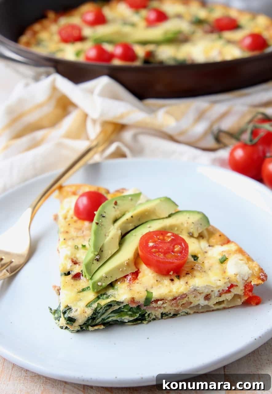 Slice of frittata on plate with fork