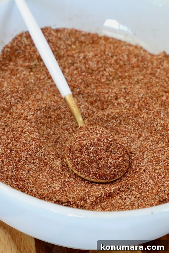 al pastor seasoning mix in a bowl with a spoon