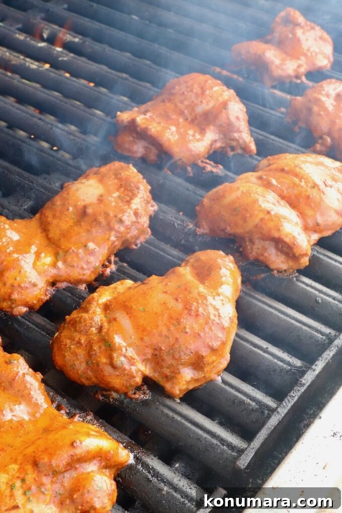 How to Make Chicken Al Pastor Tacos with Pineapple 4 marinated chicken thighs on a grill