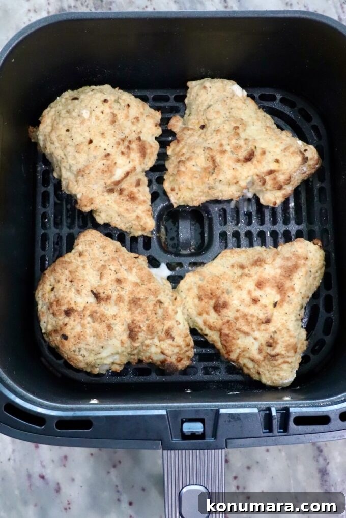 Crispy Air Fryer Chicken Sandwich Recipe 11 cooked pieces of chicken in an air fryer basket