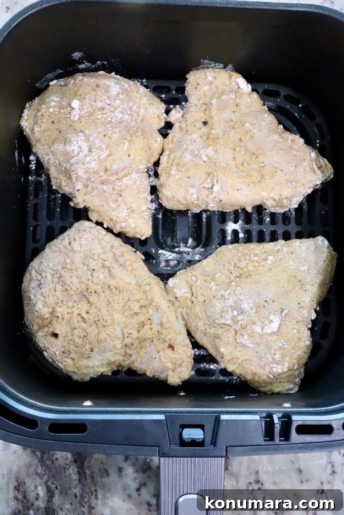 Crispy Air Fryer Chicken Sandwich Recipe 10 breaded chicken in an air fryer basket