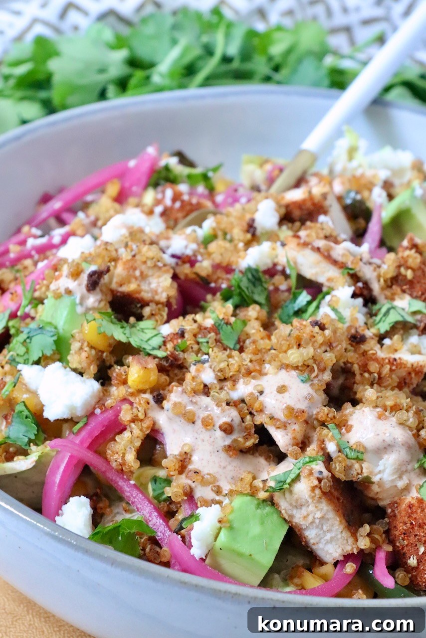 Mexican Street Corn Chicken Bowls Recipe with Cotija and Lime 6 Mexican street corn bowls with cooked chicken, crispy quinoa, and pickled onions