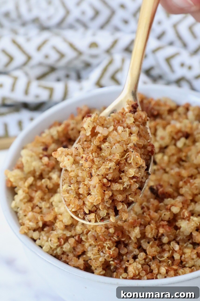 How to Make Crispy Quinoa 2 crispy quinoa in a spoon lifted out of a bowl