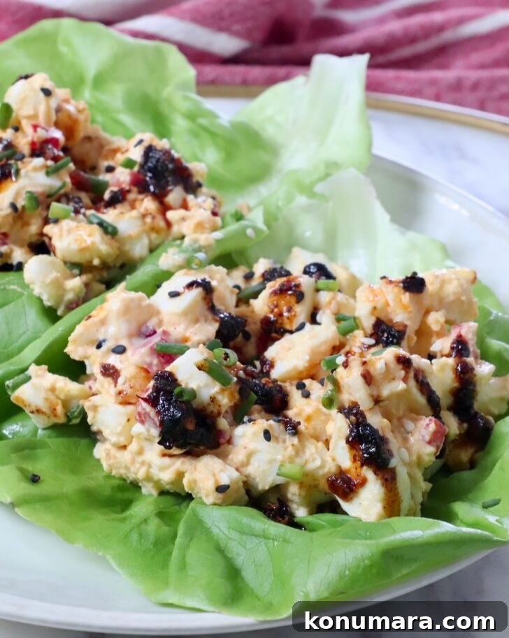 Spicy Miso Egg Salad with Chili Crisp Recipe 11 miso egg salad in lettuce leaves on a plate